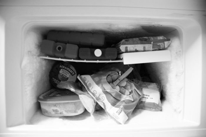 A well-stocked freezer with various food items, illustrating the importance of maintaining optimal freezer conditions for long-term storage of vegetables, such as keeping the temperature at 0°F (-18°C) and using airtight packaging.