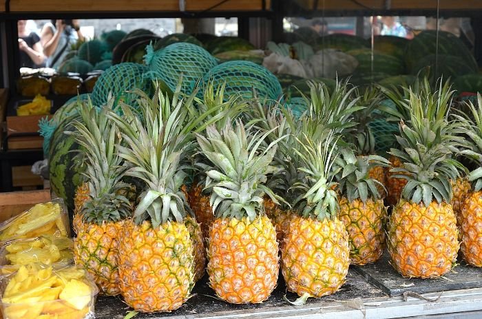 Freshly harvested ripe pineapples displayed for sale, perfect for storing and using in a variety of tasty recipes.