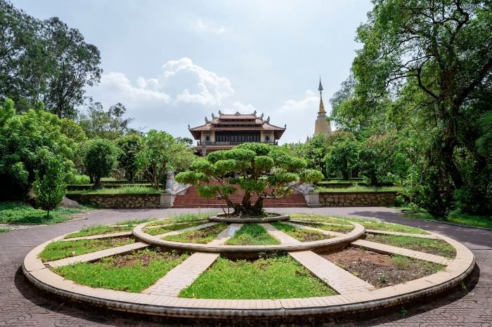 A beautiful bonsai tree in a well-maintained garden, highlighting the essentials of bonsai care, including proper watering, feeding, and sunlight requirements.