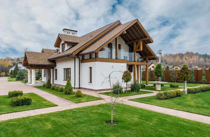 Modern home with well-maintained garden showcasing long-term soil health management practices after drought recovery.