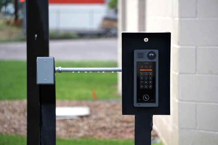 Smart lock keypad on an outdoor gate, illustrating ease of use and installation options for homeowners